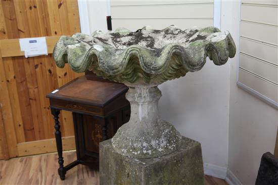 A large weathered stone garden urn, W.3ft 5in. H.3ft 11in.